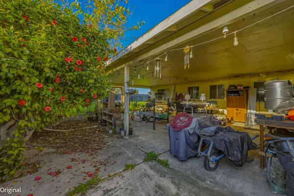 a view of a house with a yard porch and sitting area