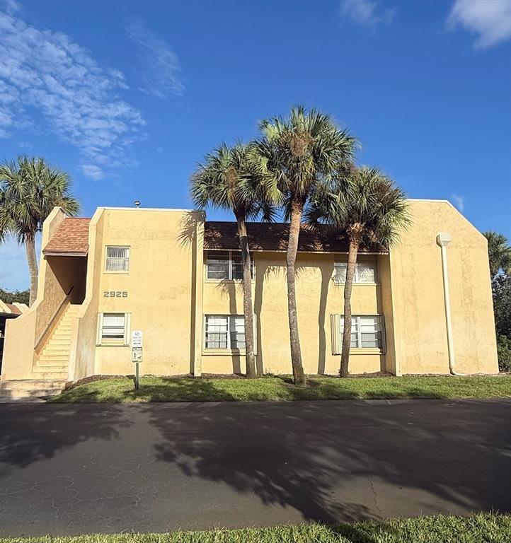a view of a house with a street