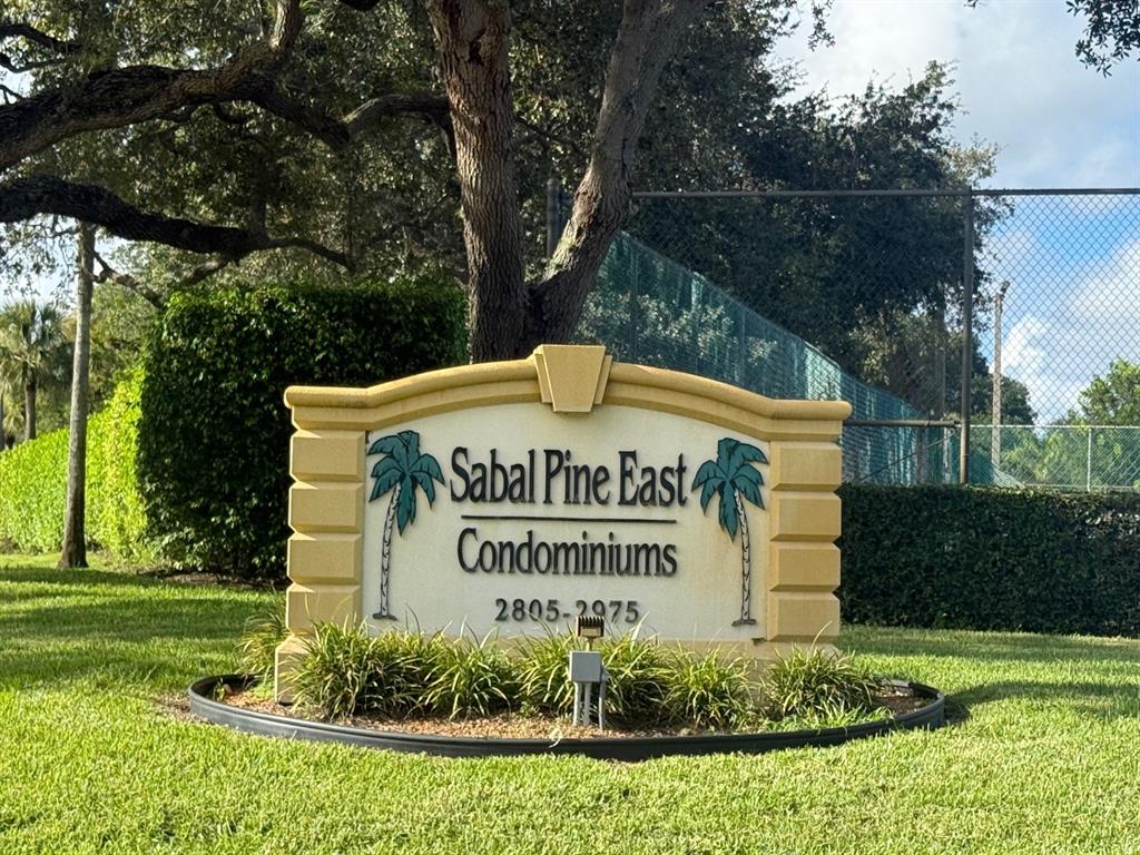 2925 Southwest 22nd Avenue, Unit 1070 Delray Beach, FL 33445 - Photo 2 of 4 a sign on the side of the road