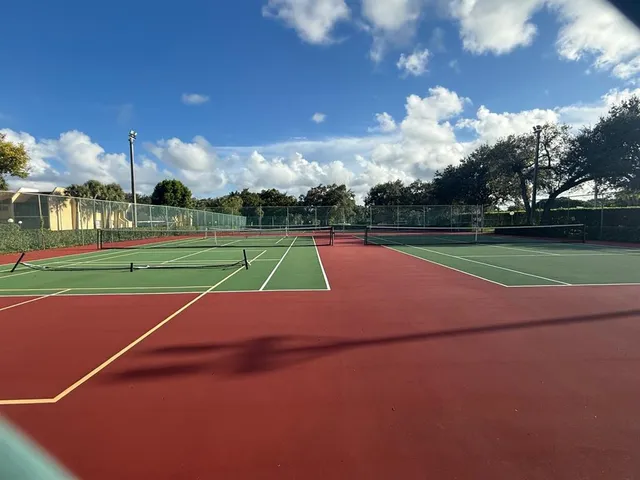 a view of an outdoor space and tennis court