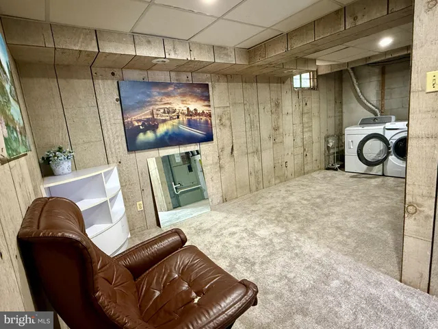 a living room with a couch and a flat screen tv