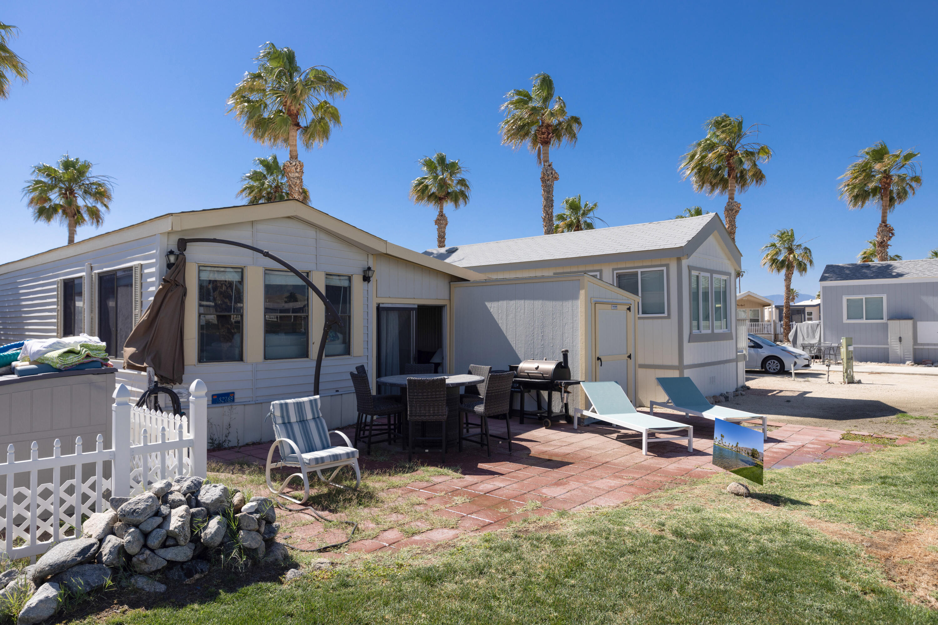 74711 Dillon Road, Unit 123 Sky Valley, CA 92241 - Photo 17 of 23 a front view of a house with garden