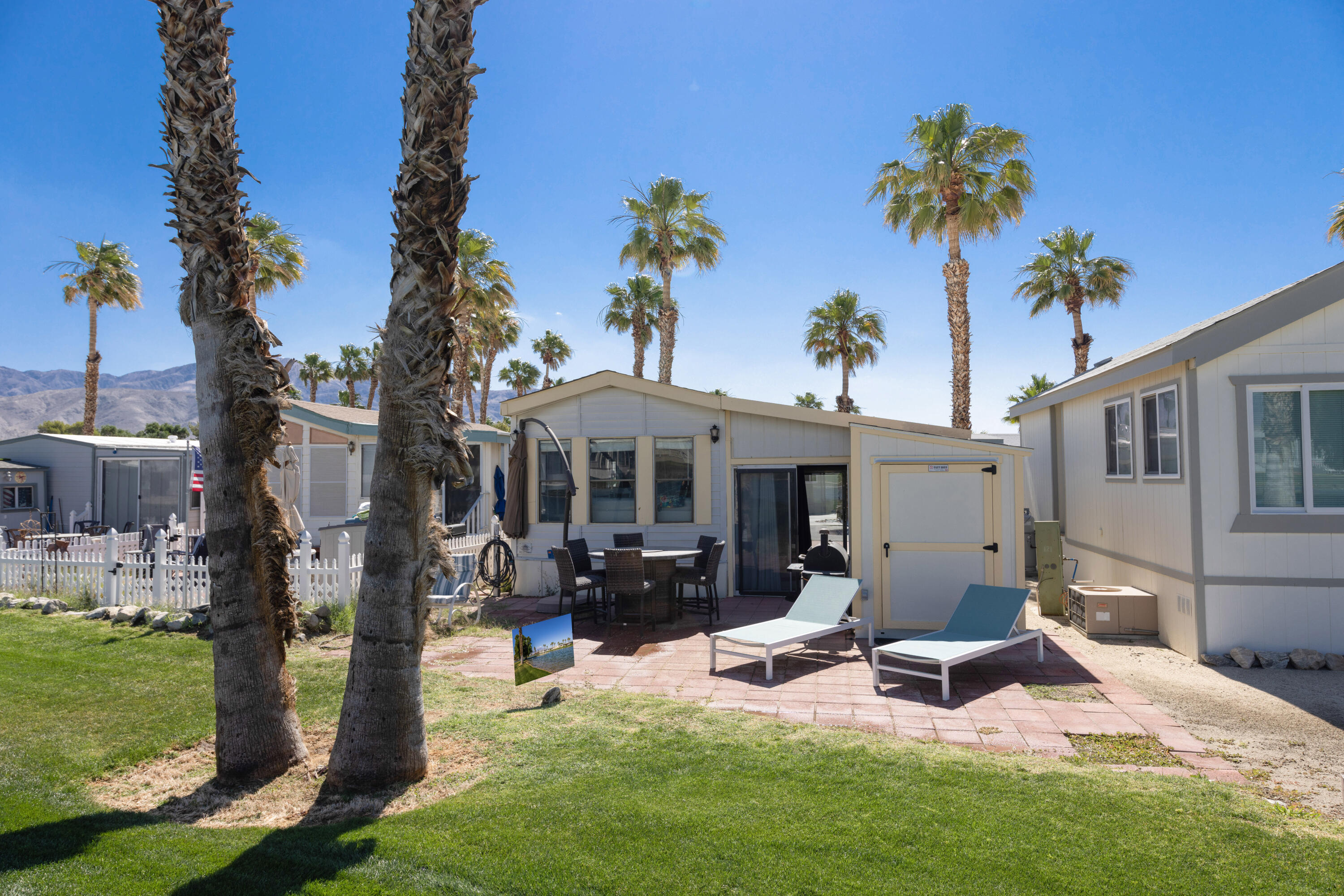 74711 Dillon Road, Unit 123 Sky Valley, CA 92241 - Photo 18 of 23 a view of a house with backyard porch and sitting area