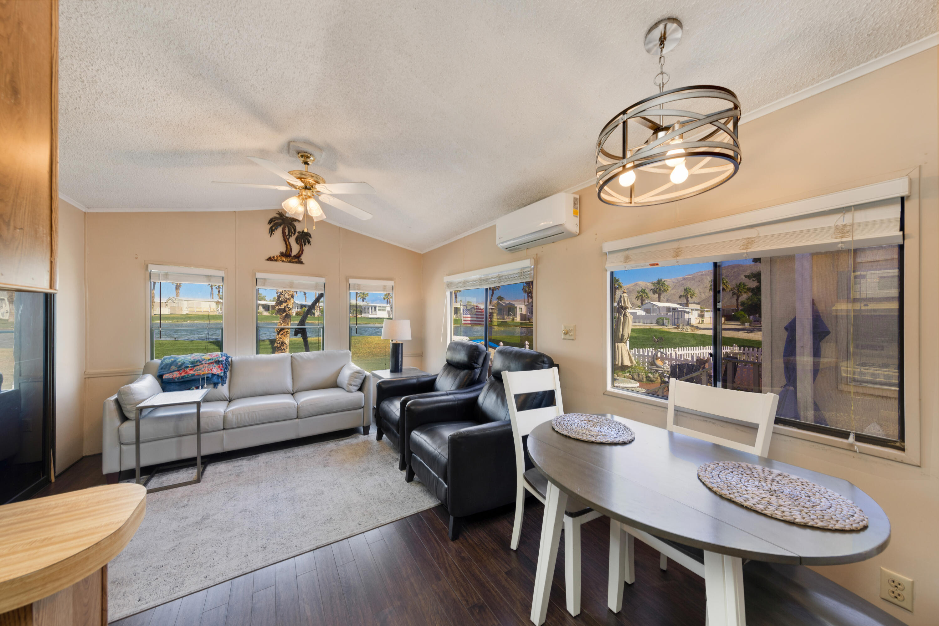 74711 Dillon Road, Unit 123 Sky Valley, CA 92241 - Photo 5 of 23 a view of a dining room with furniture wooden floor and chandelier