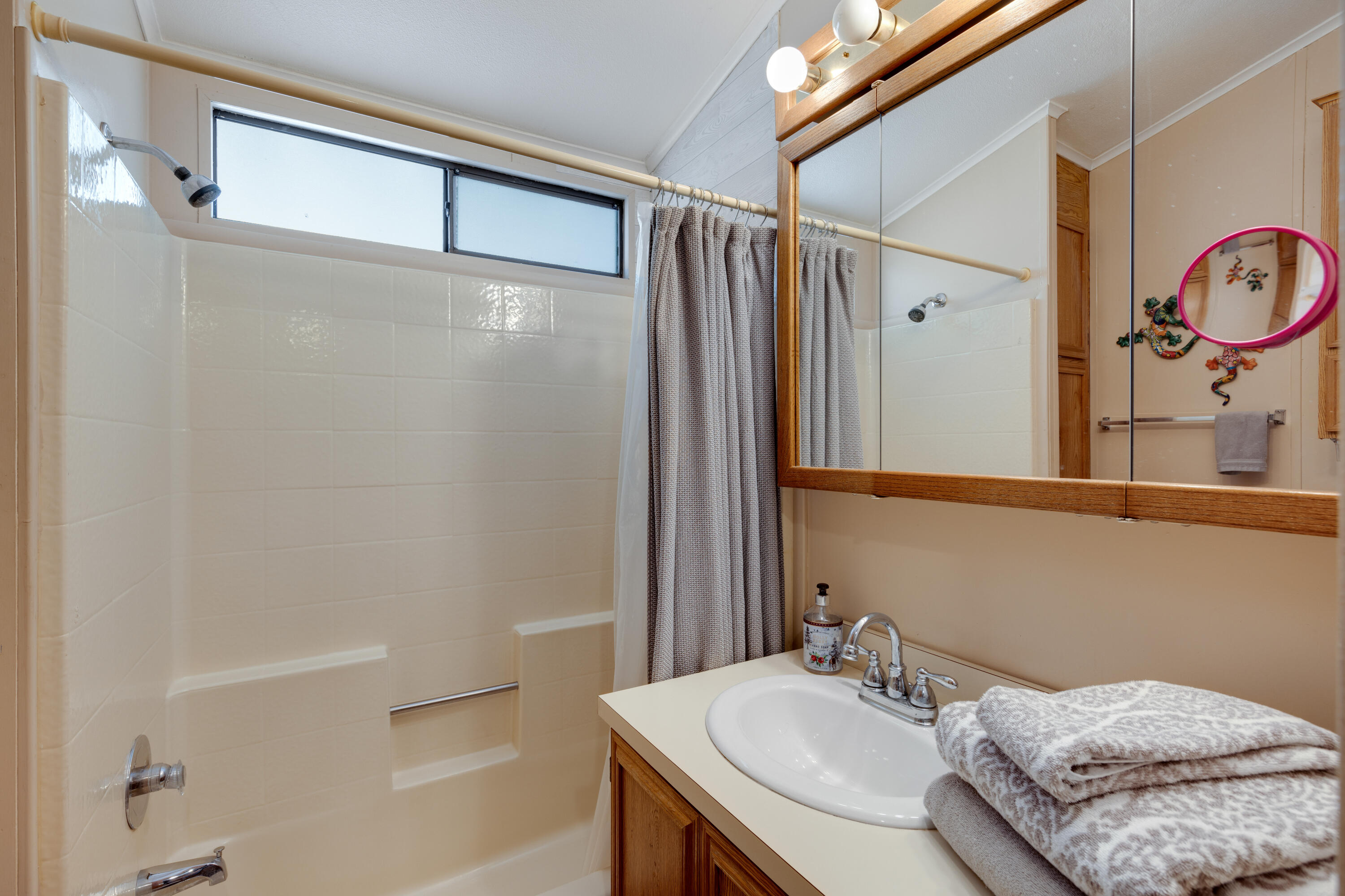 74711 Dillon Road, Unit 123 Sky Valley, CA 92241 - Photo 9 of 23 a bathroom with a granite countertop sink and a mirror
