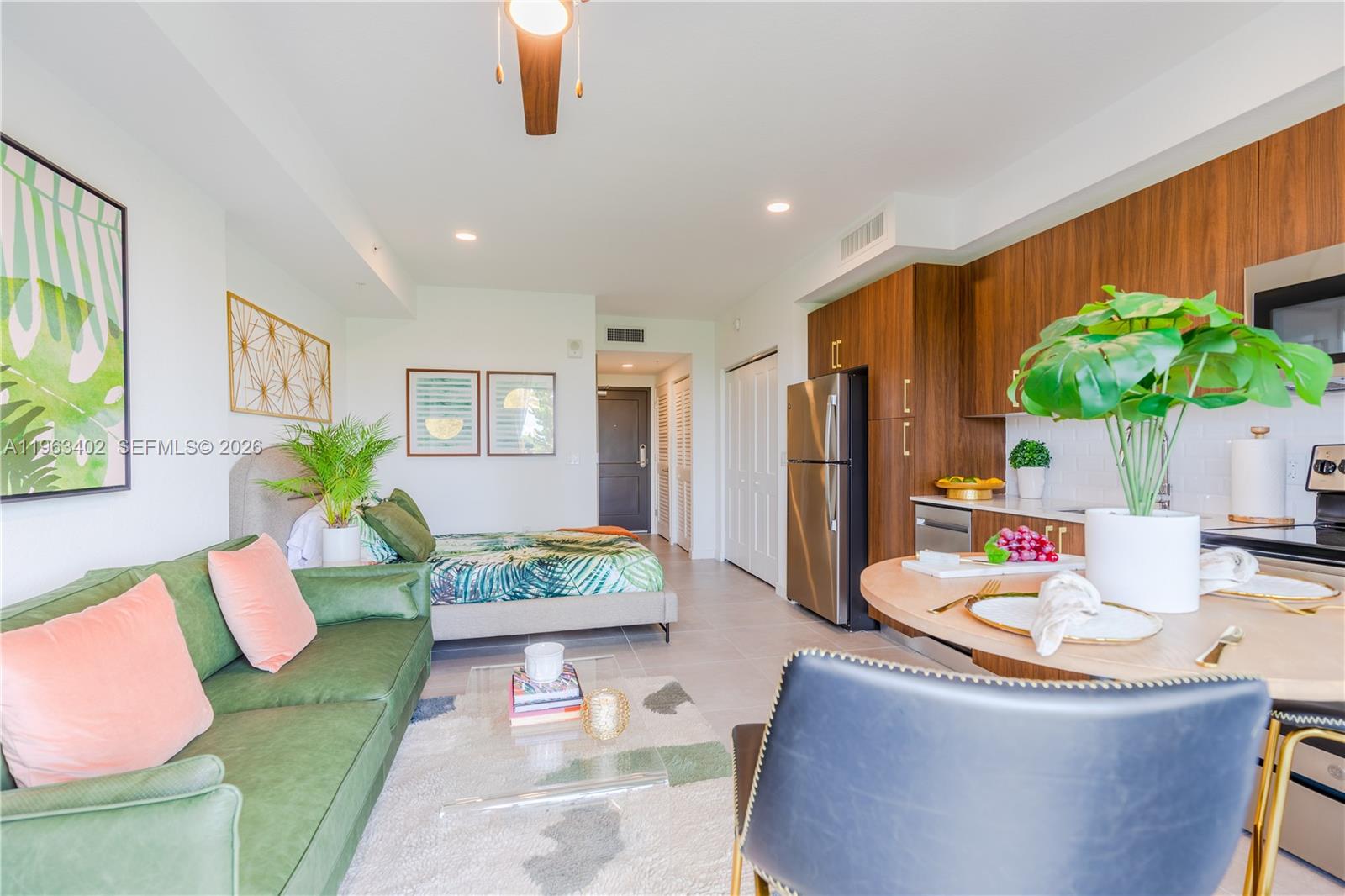 1005 Spring Garden Road, Unit 505 Miami, FL 33136 - Photo 5 of 35 a living room with furniture and a potted plant