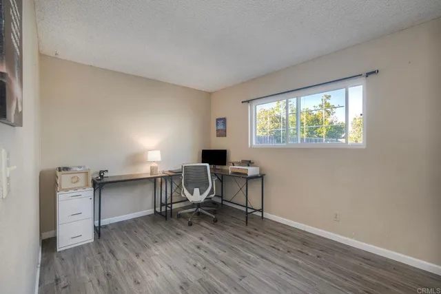 a workspace with furniture hardwood and a window