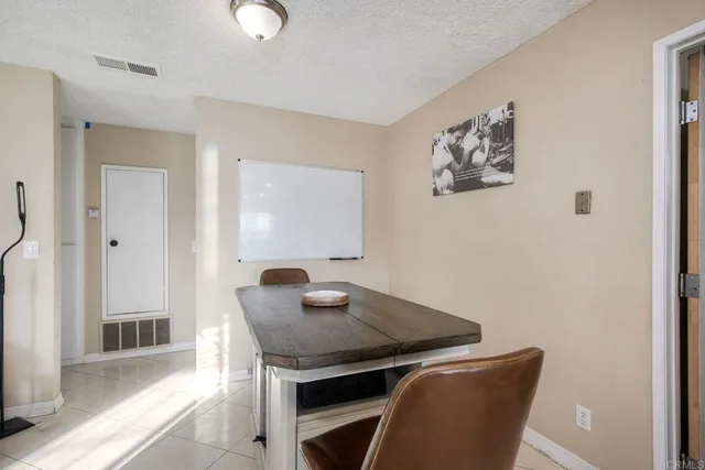 a view of a room with furniture and wooden floor