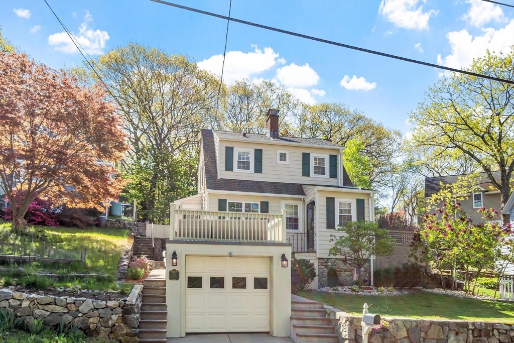 25 Naples Road Melrose, MA 02176 - Photo 27 of 36 a front view of a house with a yard