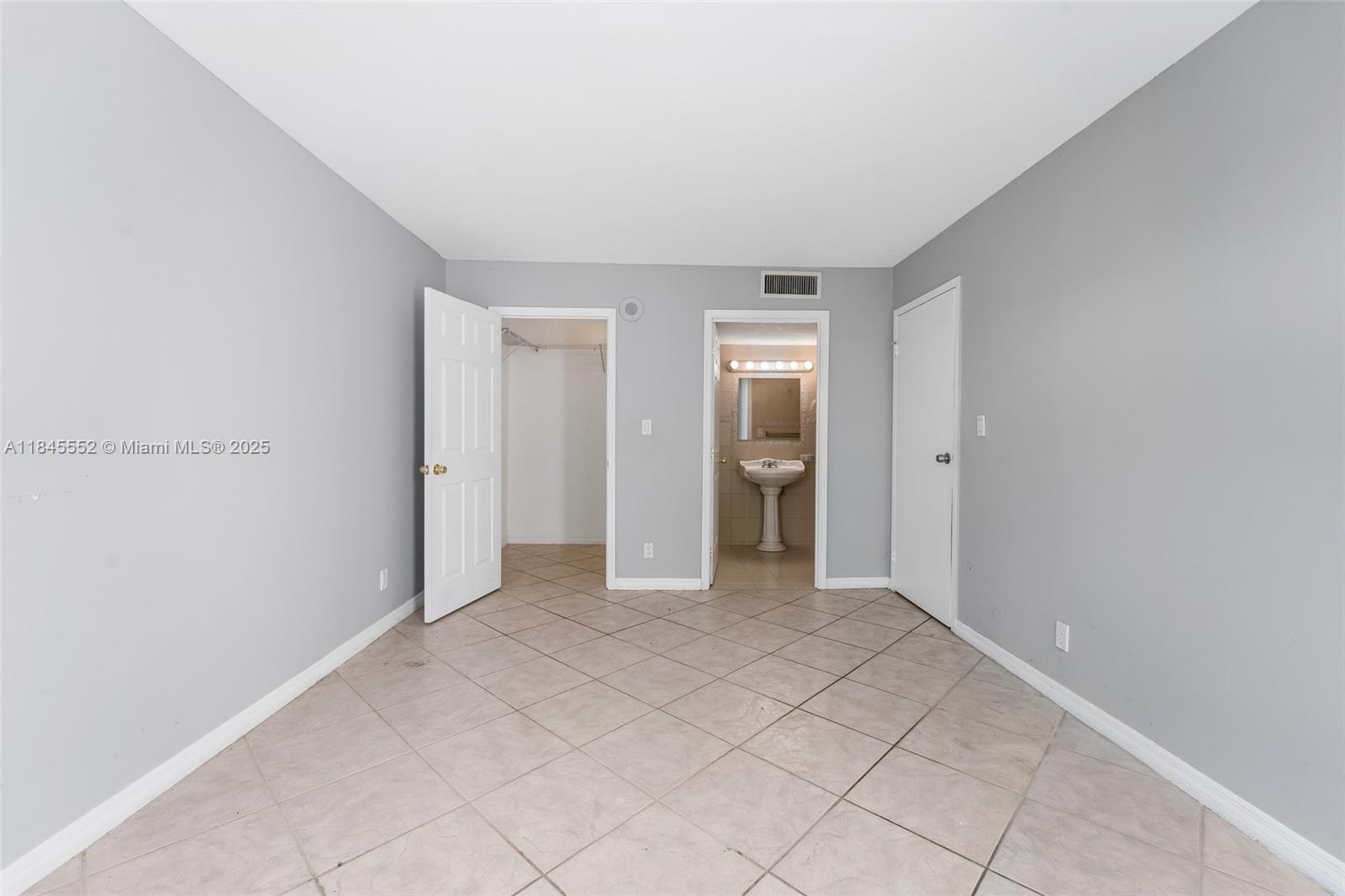 16919 North Bay Road, Unit 115 Sunny Isles Beach, FL 33160 - Photo 16 of 20 a view of an empty room and window