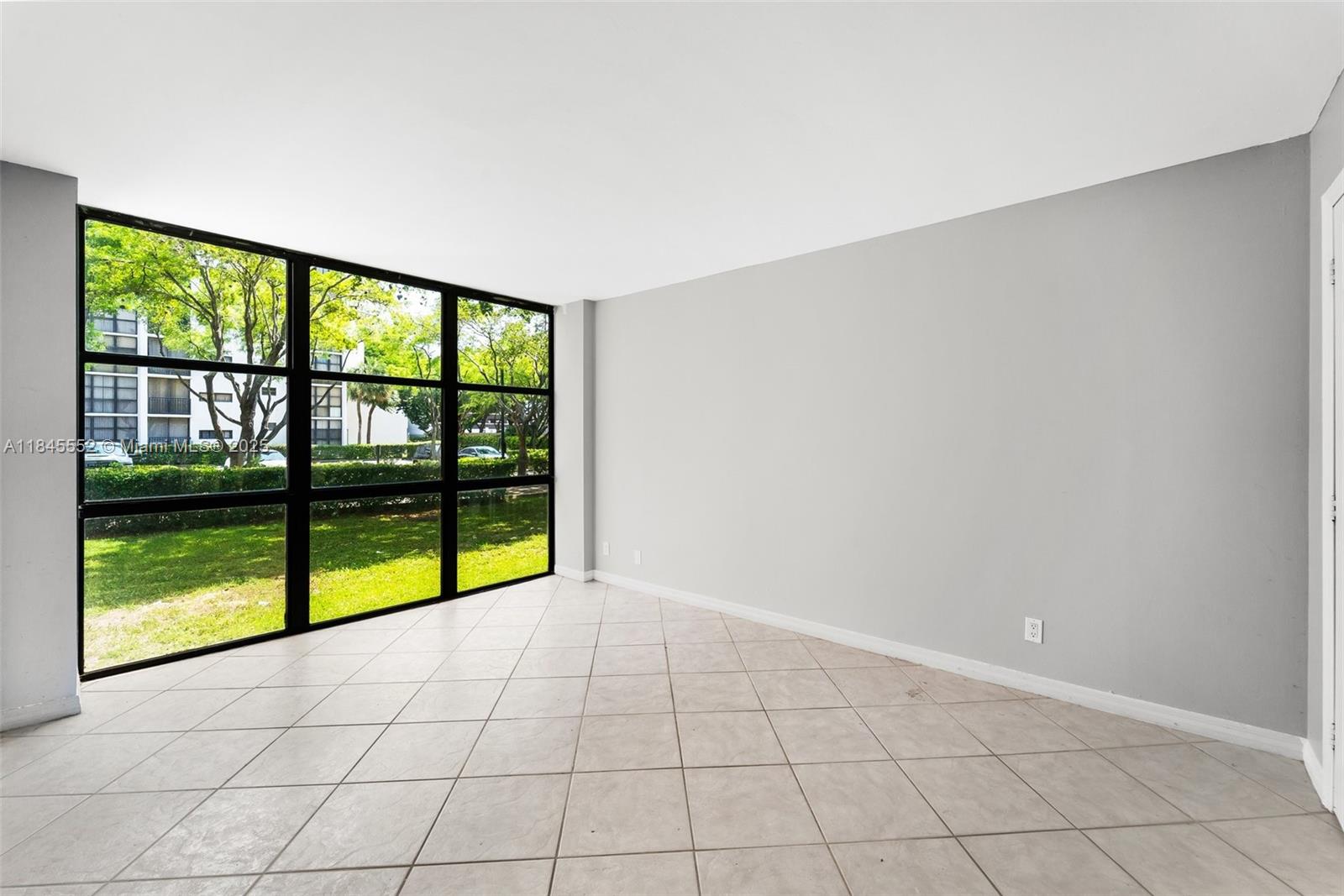 16919 North Bay Road, Unit 115 Sunny Isles Beach, FL 33160 - Photo 5 of 20 a view of an empty room and window