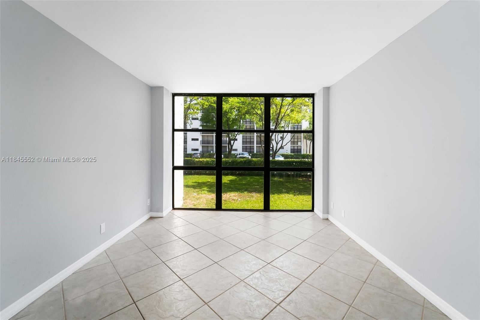 16919 North Bay Road, Unit 115 Sunny Isles Beach, FL 33160 - Photo 6 of 20 a view of an empty room with window