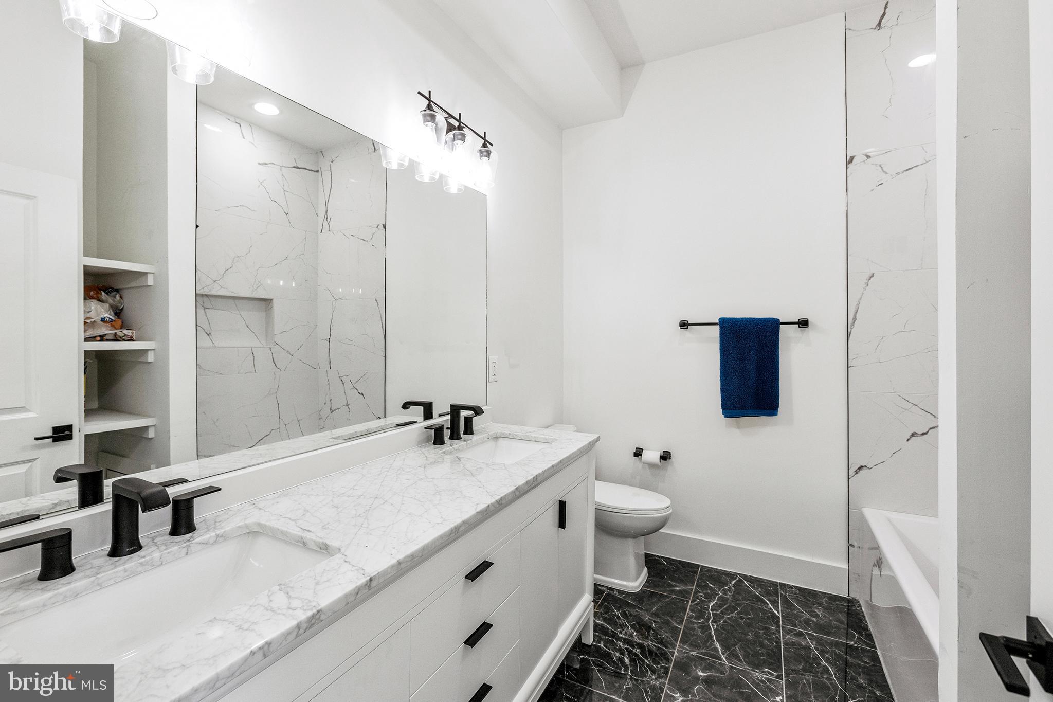 1922 1st Street Northwest, Unit B Washington, DC 20001 - Photo 16 of 49 Sleek modern bathroom with elegant finishes.