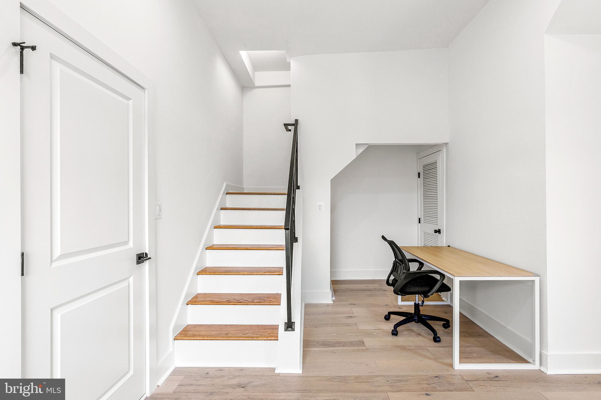 1922 1st Street Northwest, Unit B Washington, DC 20001 - Photo 22 of 49 Modern entryway with sleek staircase design.
