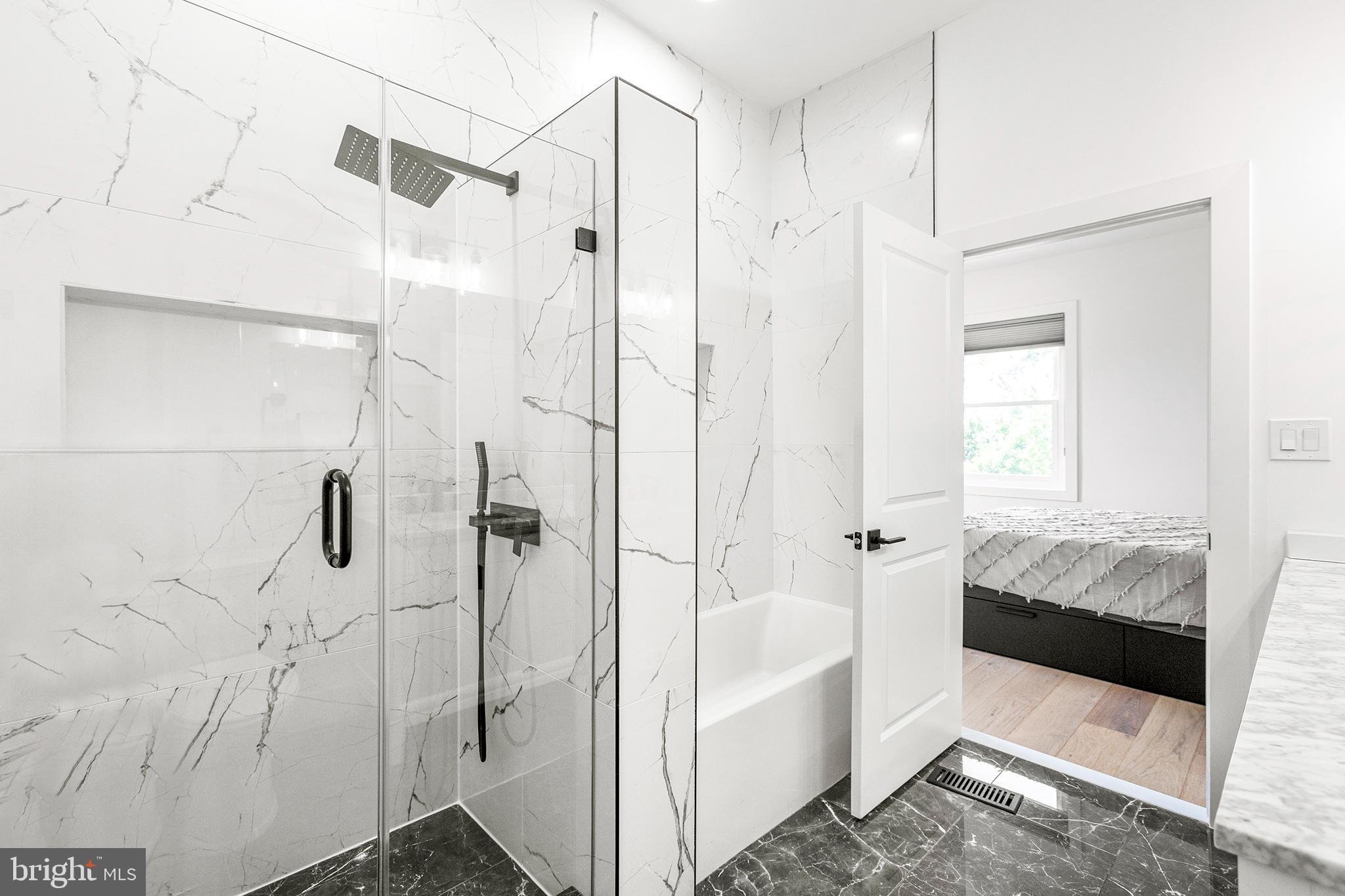 1922 1st Street Northwest, Unit B Washington, DC 20001 - Photo 26 of 49 Sleek marble bathroom with modern fixtures.