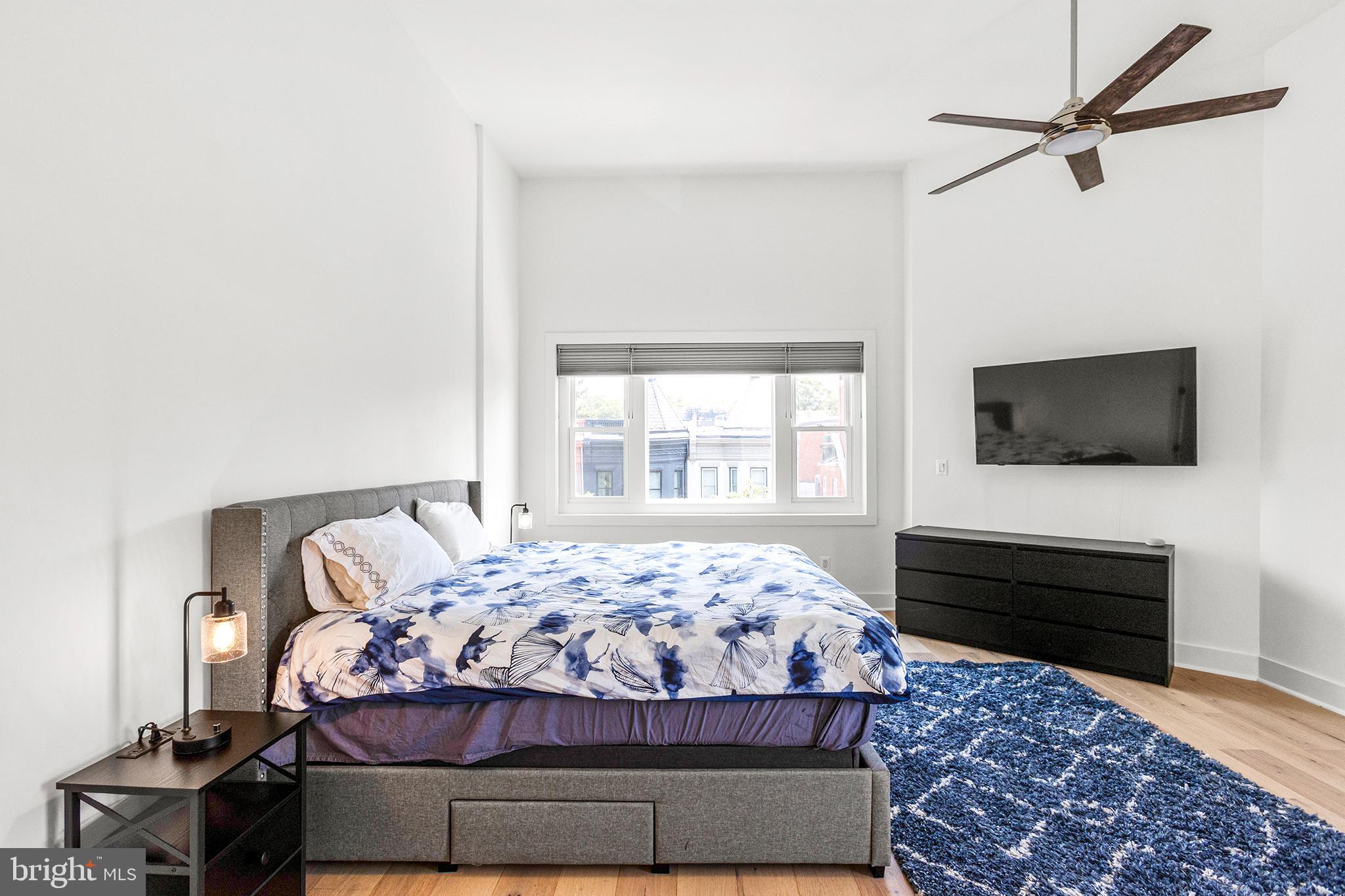 1922 1st Street Northwest, Unit B Washington, DC 20001 - Photo 32 of 49 Serene bedroom with modern elegance.