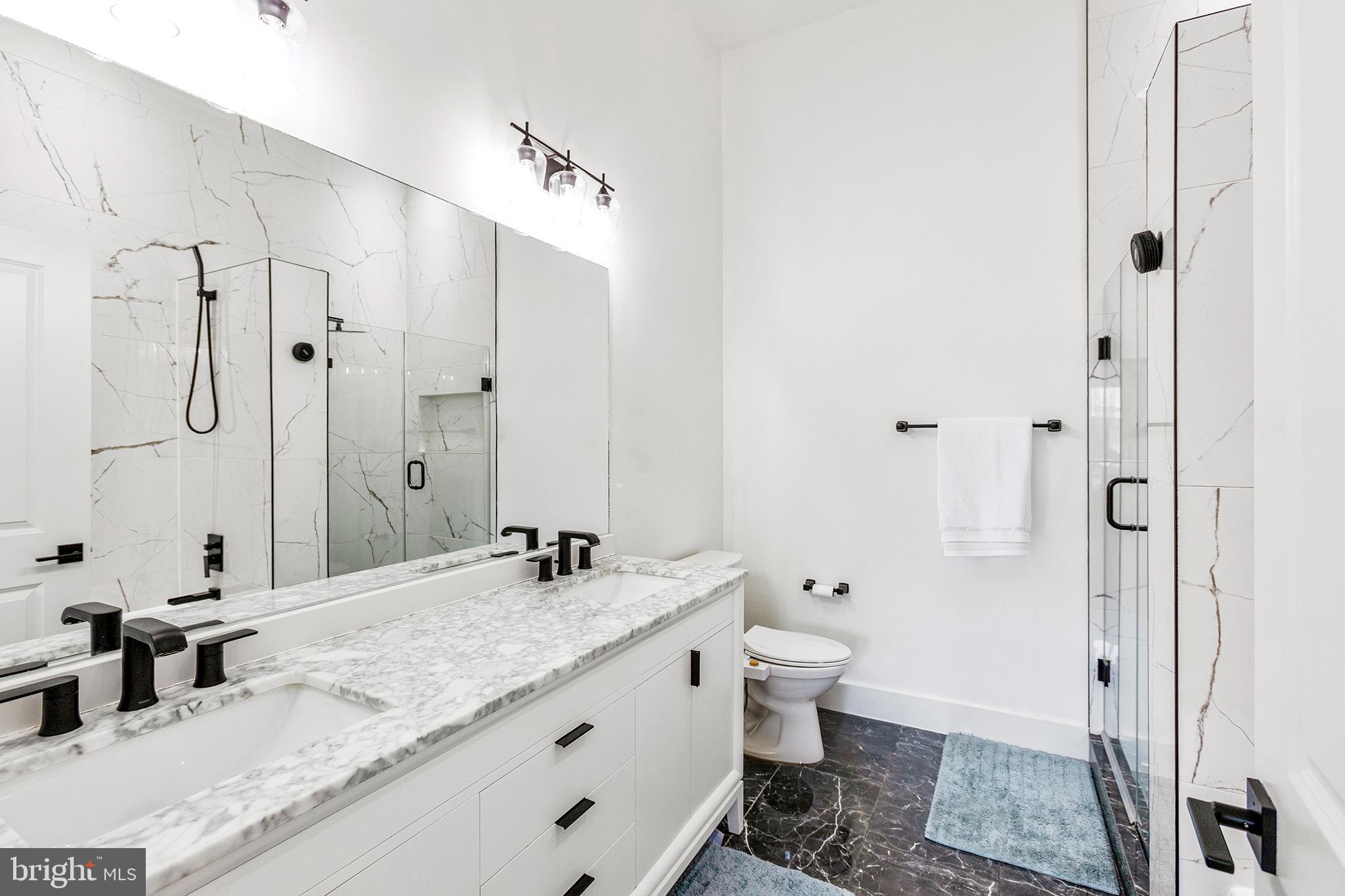 1922 1st Street Northwest, Unit B Washington, DC 20001 - Photo 33 of 49 Sleek modern bathroom with elegant finishes.