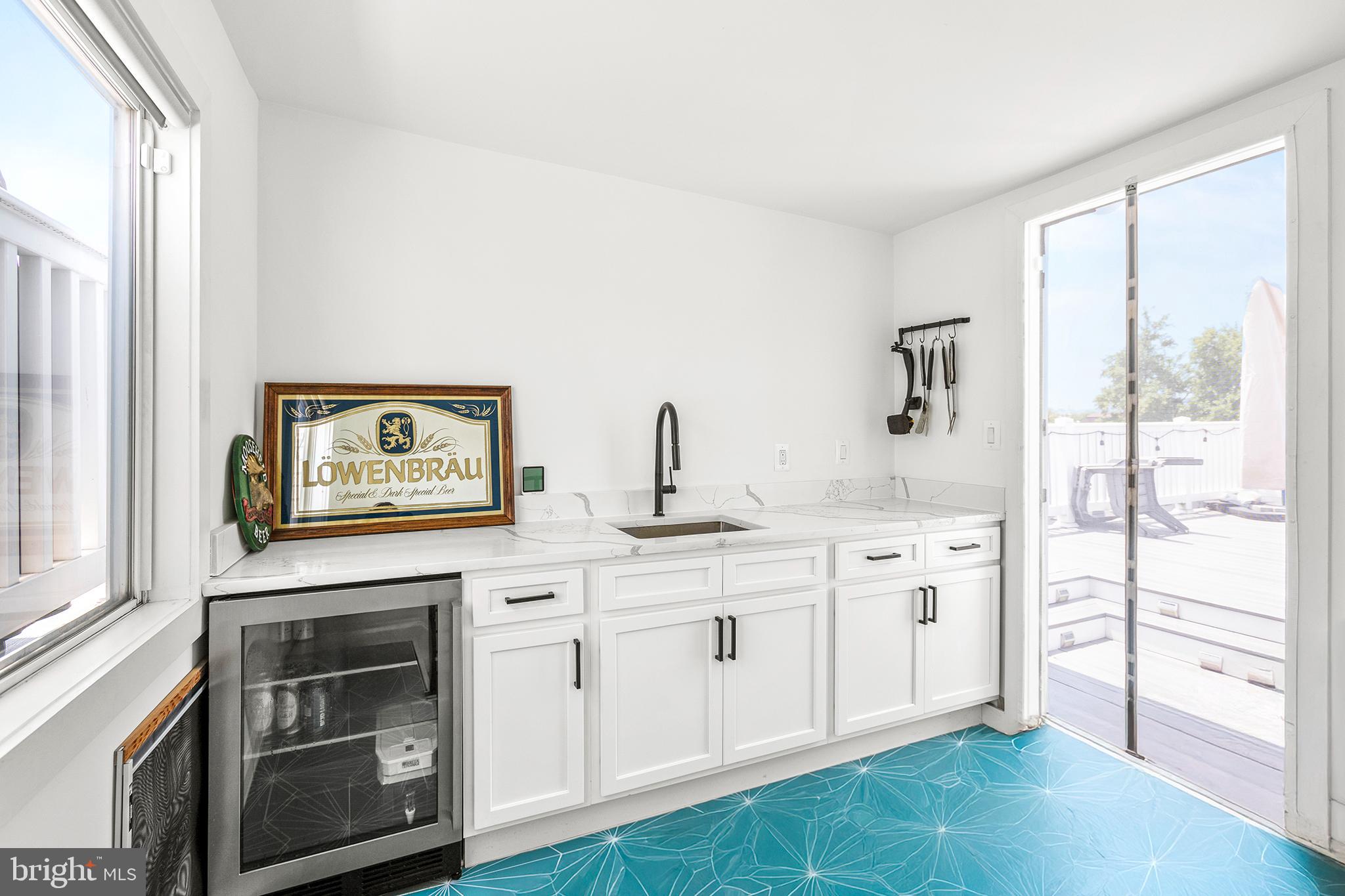 1922 1st Street Northwest, Unit B Washington, DC 20001 - Photo 36 of 49 Bright and modern kitchen with vibrant tiles.