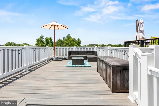 a view of a roof deck with couches