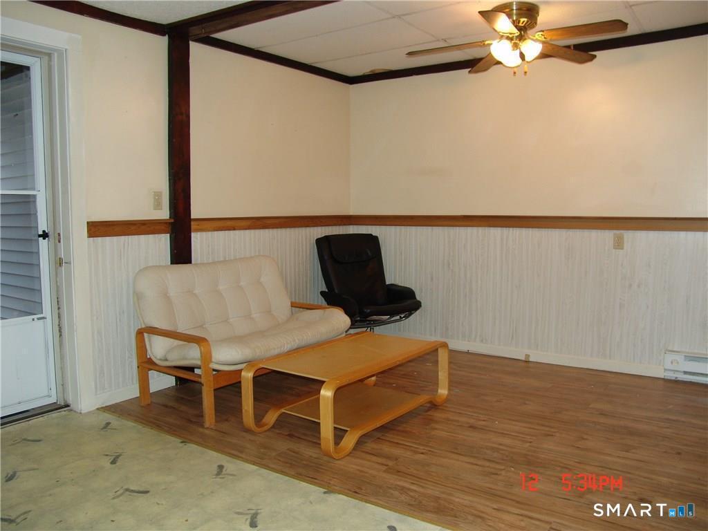 641 Wauregan Road Brooklyn, CT 06234 - Photo 14 of 22 Unit B, Living room. Pictures are when unit was vacant. Currently Occupied.