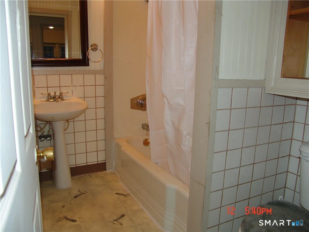 641 Wauregan Road Brooklyn, CT 06234 - Photo 9 of 22 Unit A, Full bath. Pictures are when unit was vacant. Currently Occupied.