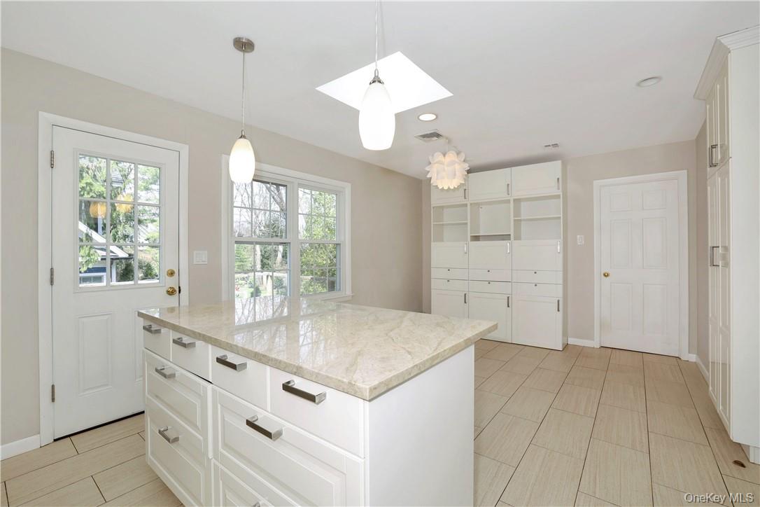 3 Lea Place Rye, NY 10580 - Photo 11 of 32 a view of kitchen with granite countertop cabinets and chandelier