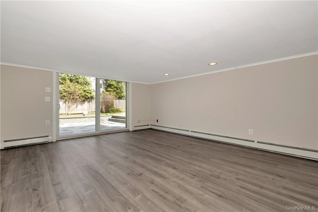 3 Lea Place Rye, NY 10580 - Photo 19 of 32 a view of an empty room with wooden floor and a window
