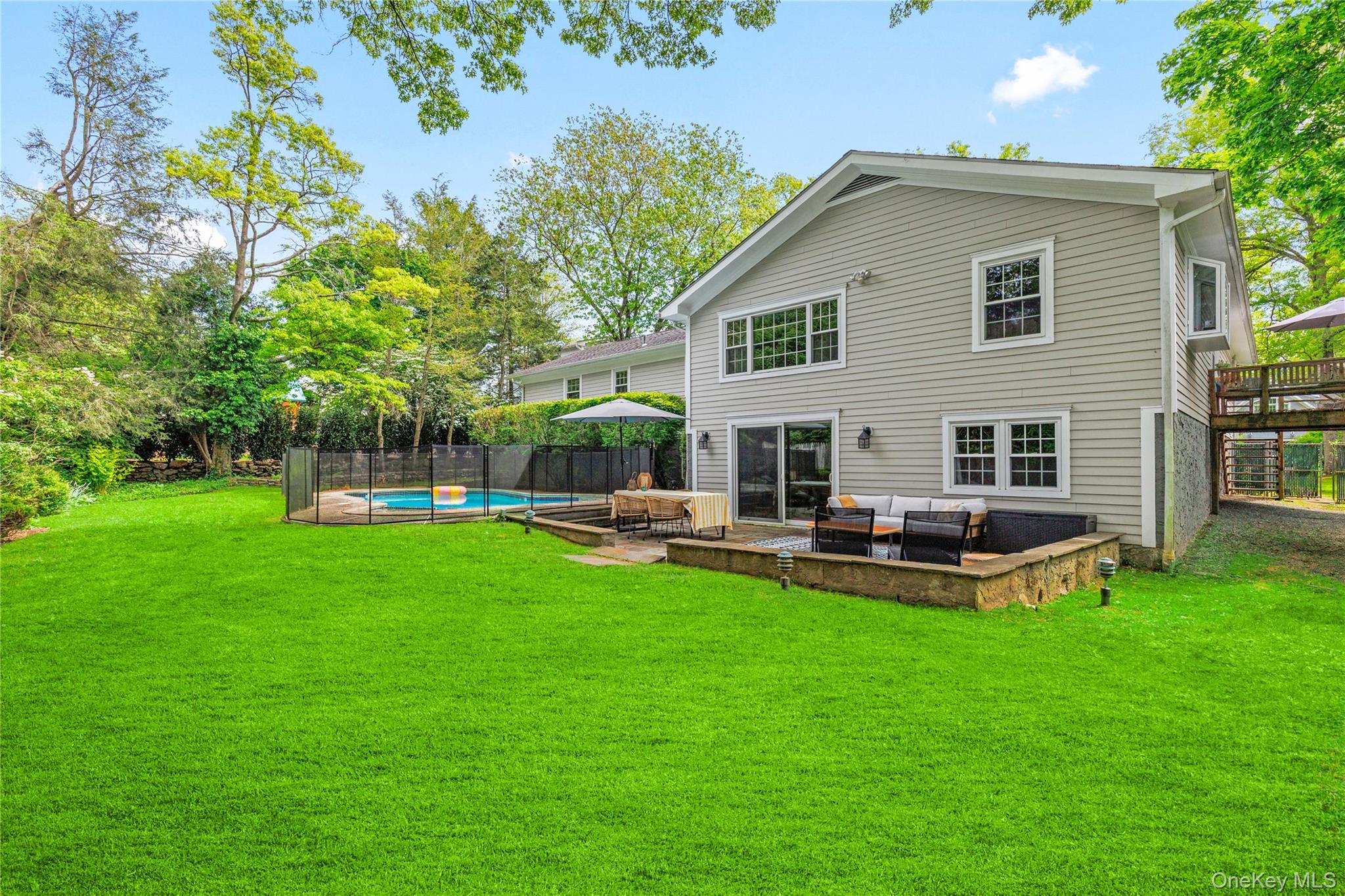 3 Lea Place Rye, NY 10580 - Photo 25 of 32 a view of a house with a yard and sitting area