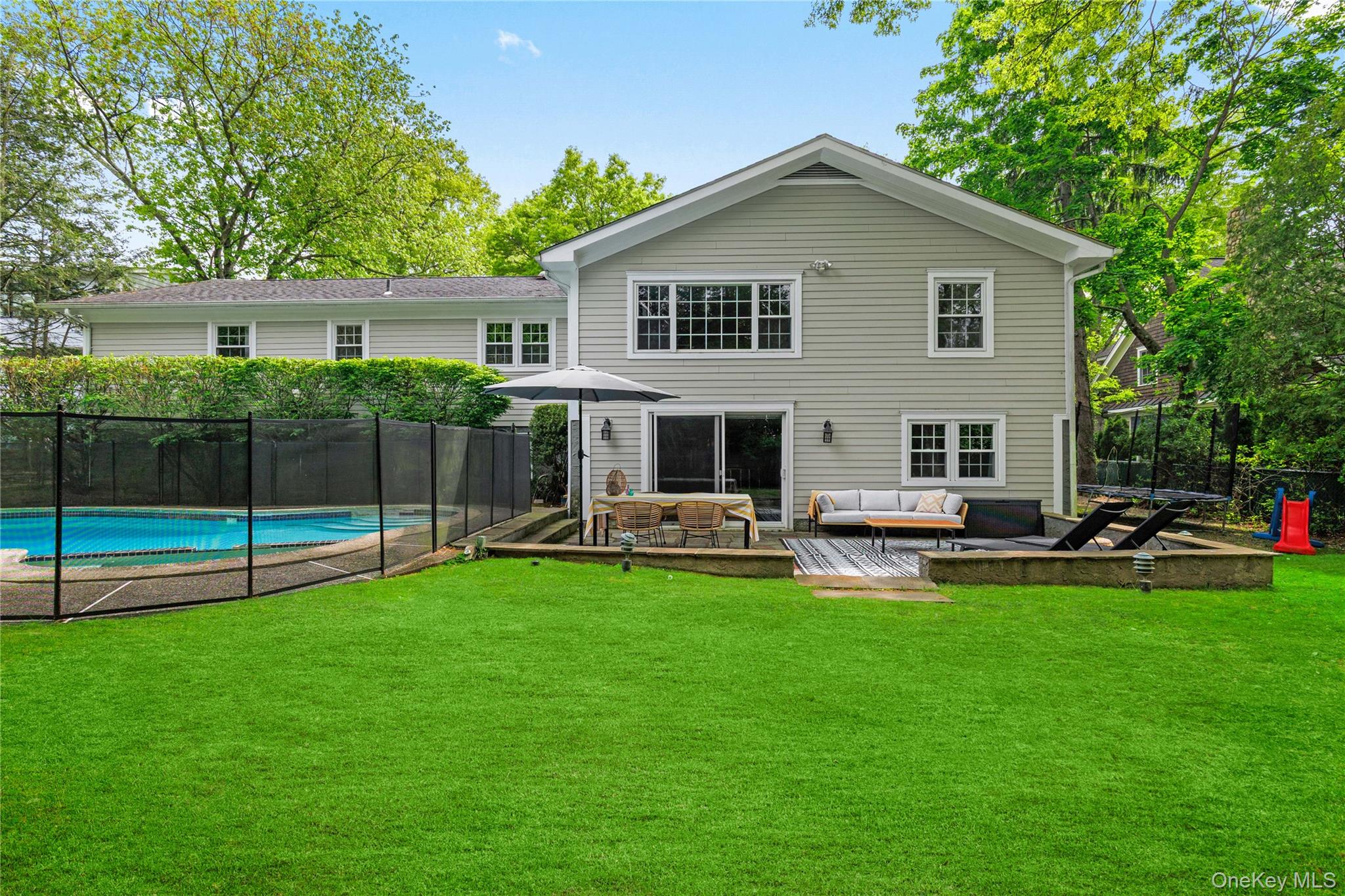 3 Lea Place Rye, NY 10580 - Photo 29 of 32 a view of a house with a yard and deck
