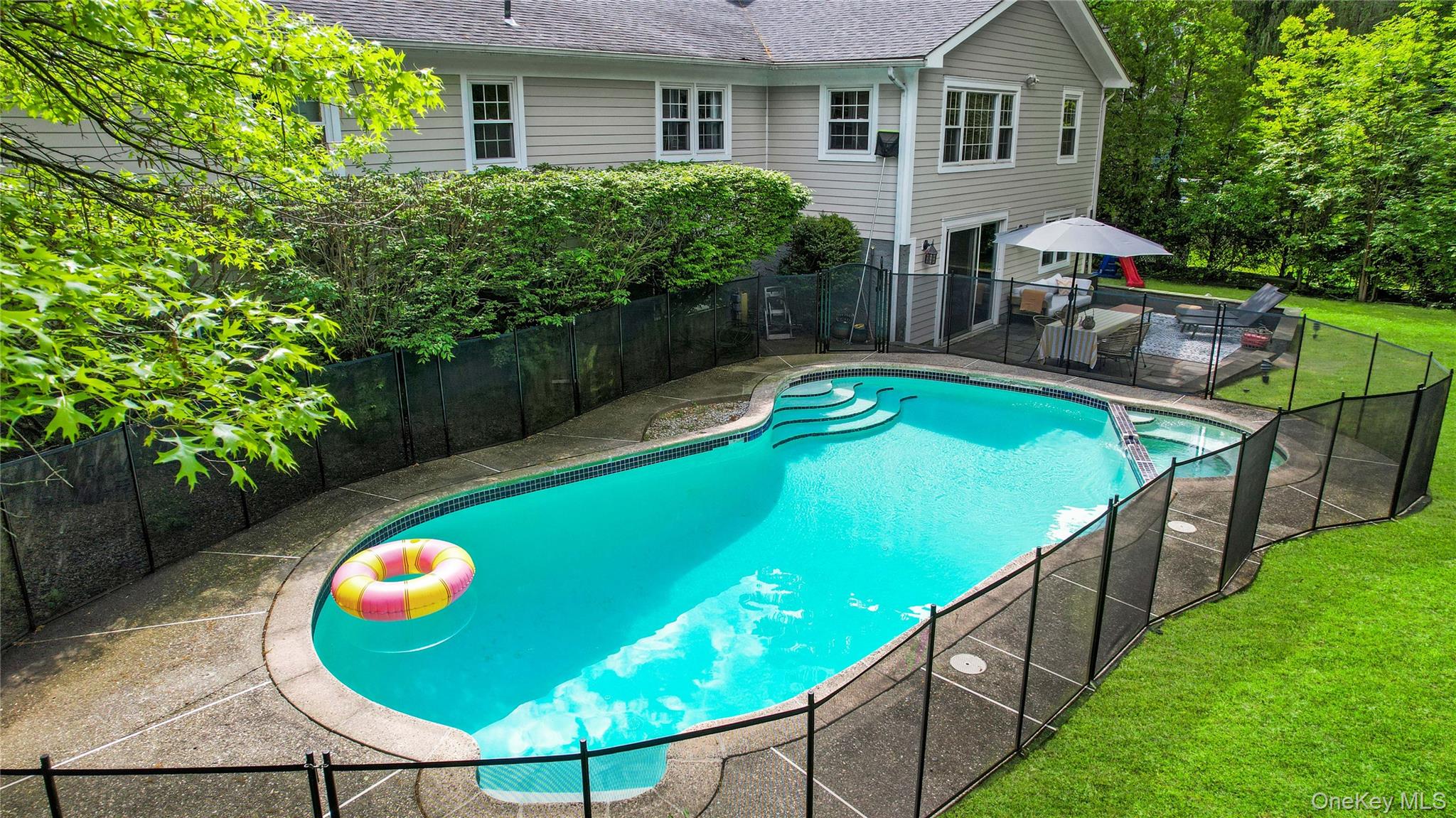 3 Lea Place Rye, NY 10580 - Photo 32 of 32 swimming pool view with a seating space and garden view