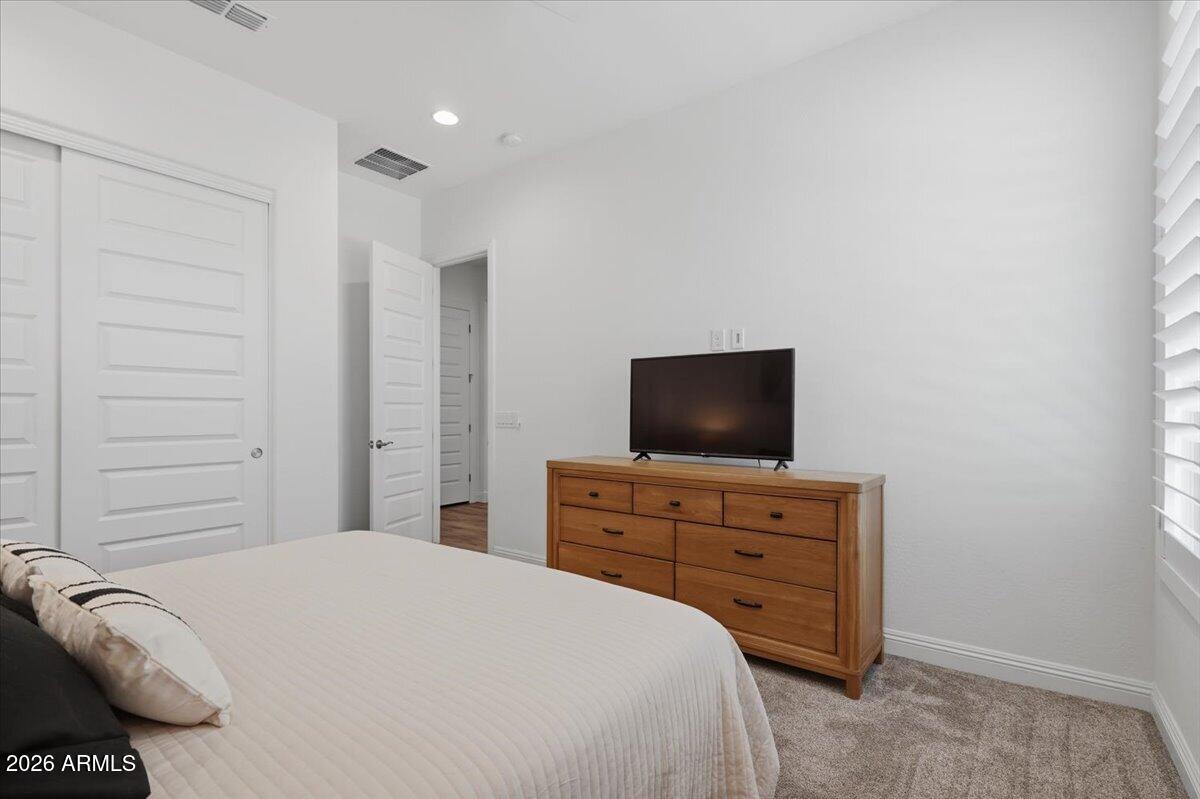 22608 East Stacey Road Queen Creek, AZ 85142 - Photo 7 of 83 a bedroom with a bed and a television
