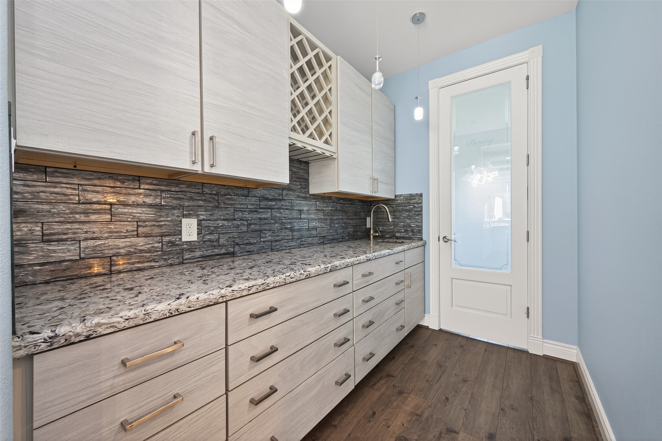 2504 Southline Road Conroe, TX 77384 - Photo 9 of 26 a kitchen with granite countertop white cabinets and white appliances