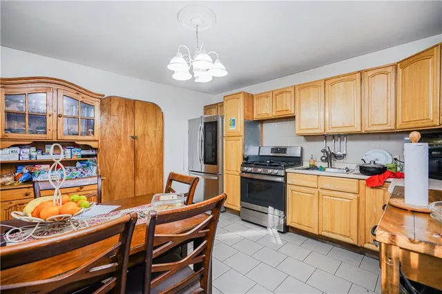 a kitchen with stainless steel appliances granite countertop a stove and cabinets