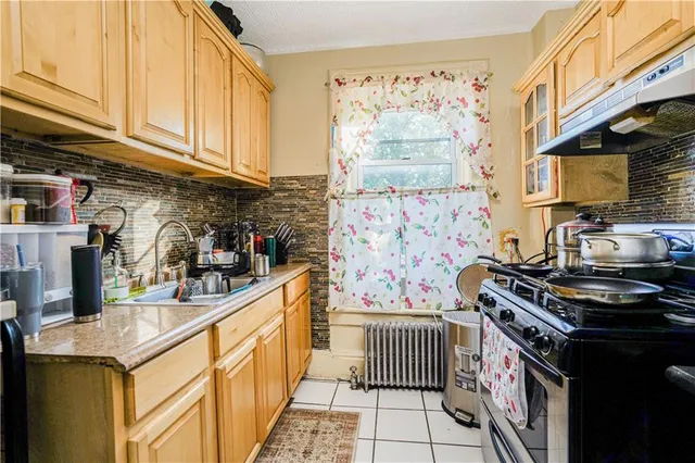 a kitchen with stainless steel appliances granite countertop a stove and a sink