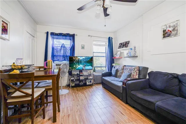 a living room with furniture or couch and a wooden floor