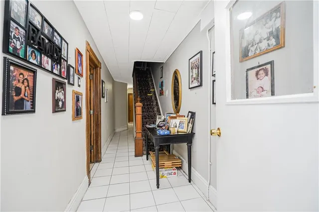 a view of a hallway with seating area