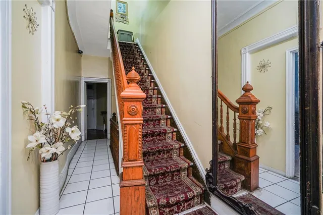 a hallway with front door wooden floor