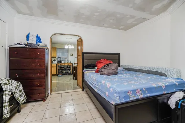 a bedroom with a bed and cabinets