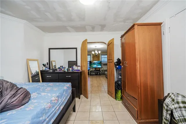 a bed room with a bed and a mirror