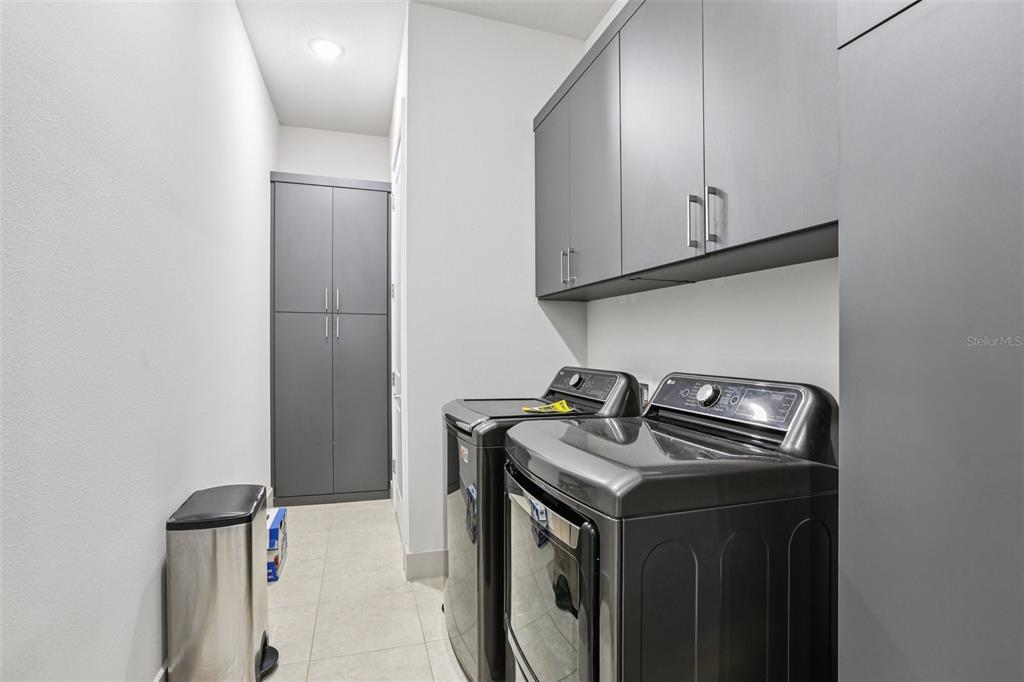 8743 Sanders Tree Loop Wesley Chapel, FL 33545 - Photo 18 of 41 a utility room with dryer and washer
