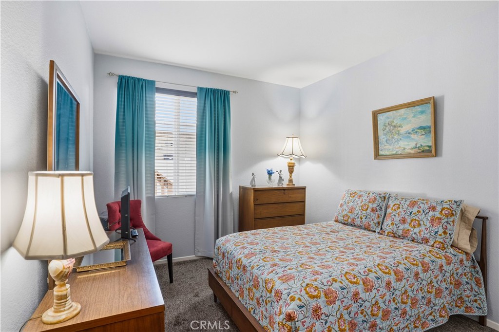 29183 Paperflower Lane Menifee, CA 92584 - Photo 18 of 49 a bedroom with bed and window