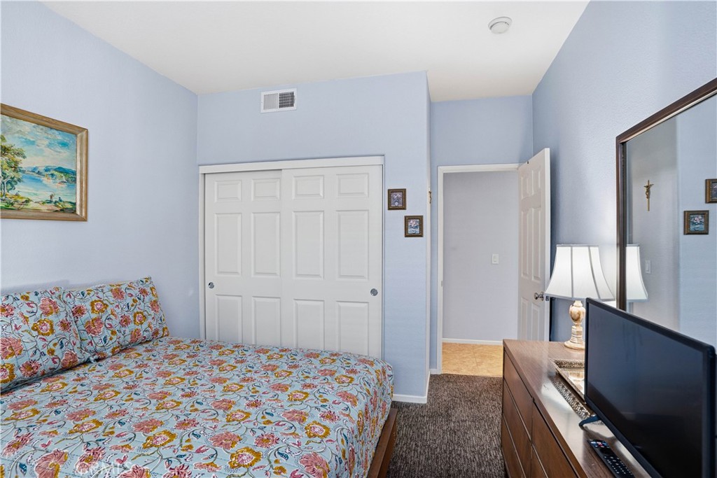 29183 Paperflower Lane Menifee, CA 92584 - Photo 19 of 49 a bedroom with a bed and furniture