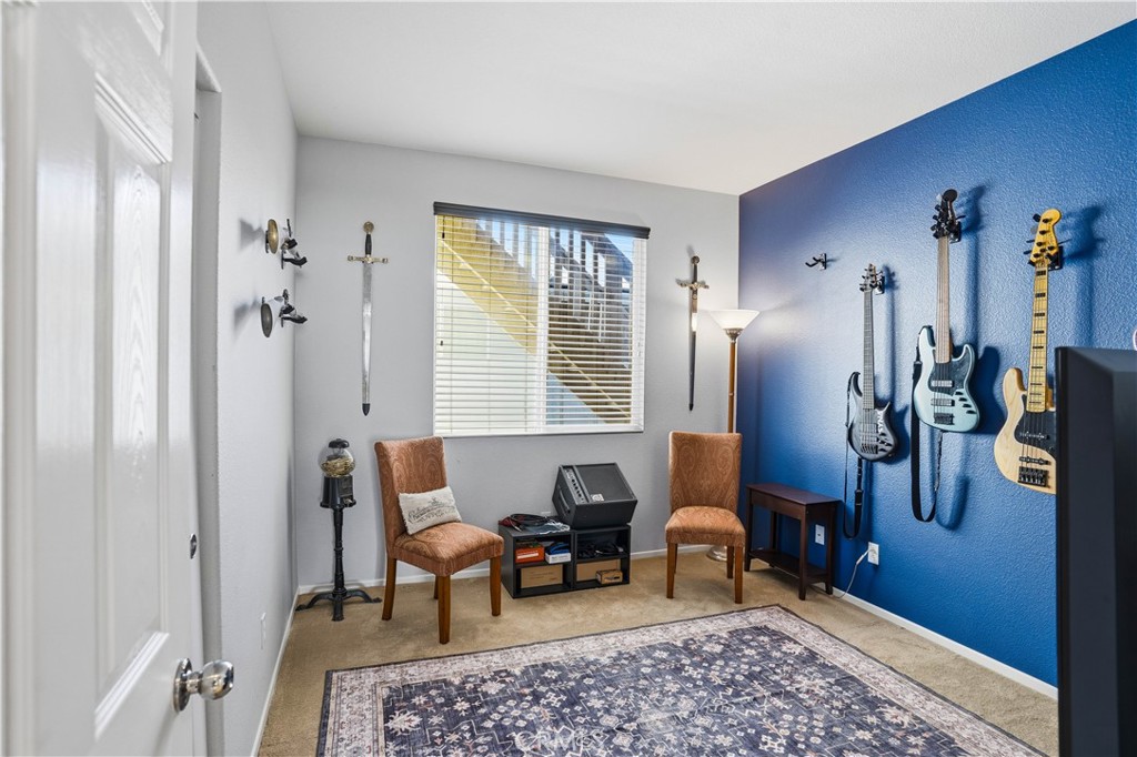 29183 Paperflower Lane Menifee, CA 92584 - Photo 20 of 49 a living room with furniture rug and window