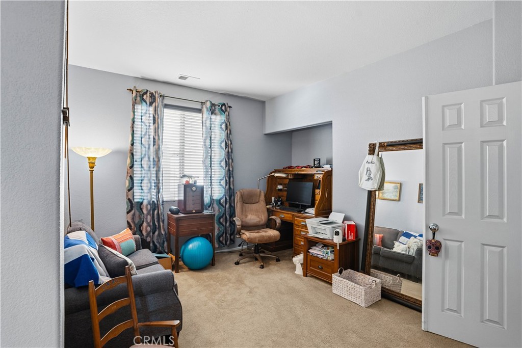 29183 Paperflower Lane Menifee, CA 92584 - Photo 23 of 49 a room with furniture and a chair