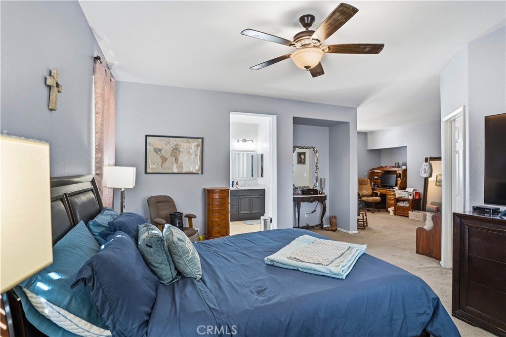29183 Paperflower Lane Menifee, CA 92584 - Photo 25 of 49 a view of a livingroom with furniture and a flat screen tv