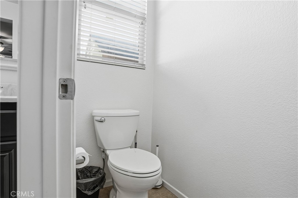 29183 Paperflower Lane Menifee, CA 92584 - Photo 28 of 49 a white toilet sitting next to a window
