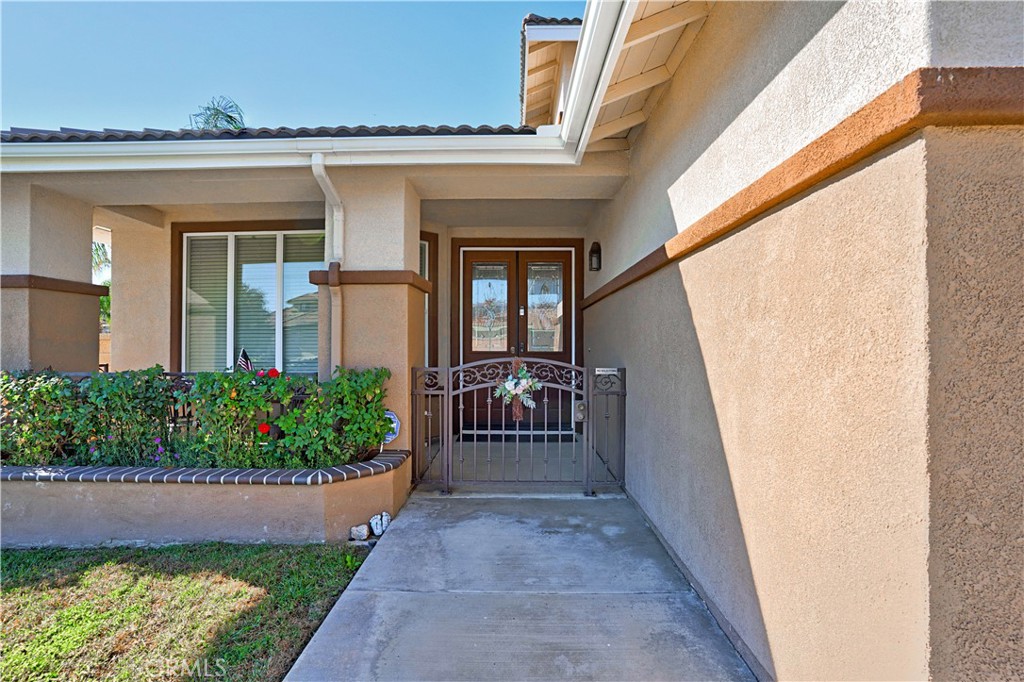 29183 Paperflower Lane Menifee, CA 92584 - Photo 3 of 49 front view of a house with a bench