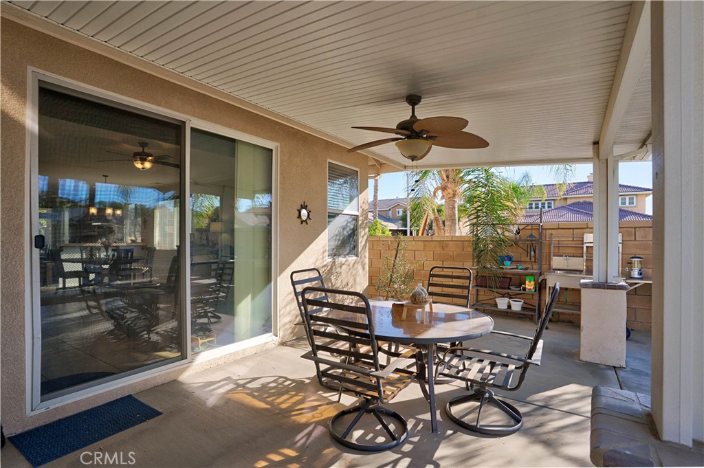29183 Paperflower Lane Menifee, CA 92584 - Photo 38 of 49 a dining room with furniture wooden floor and a chandelier