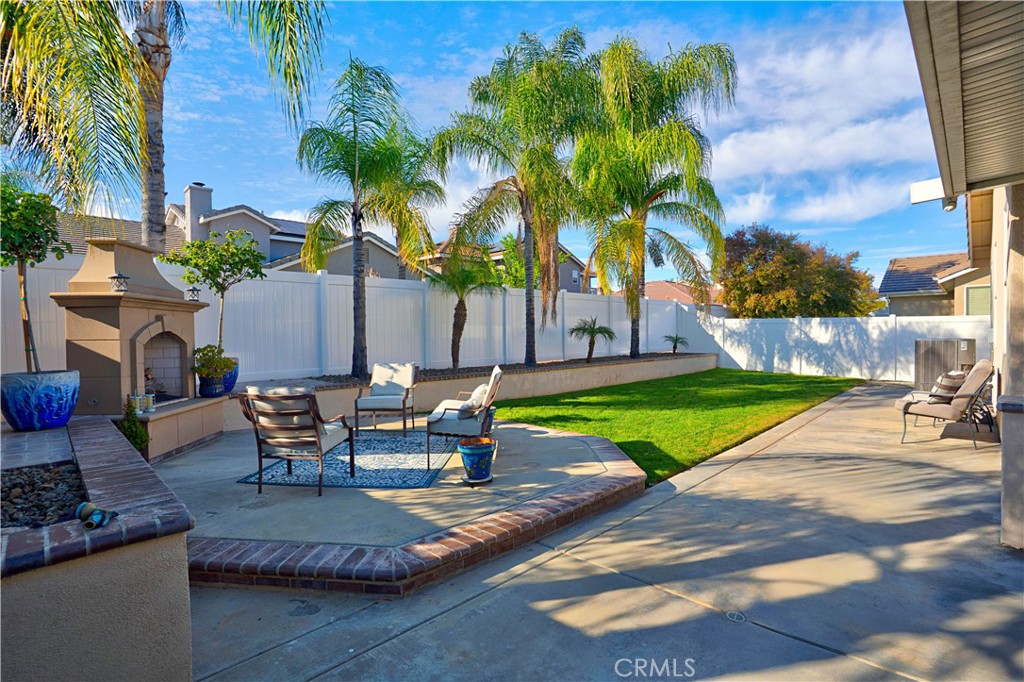 29183 Paperflower Lane Menifee, CA 92584 - Photo 40 of 49 a view of a backyard with sitting area