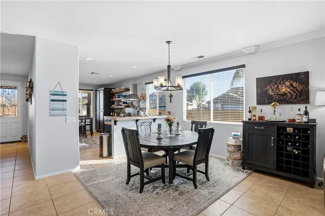 a dining room with furniture and window